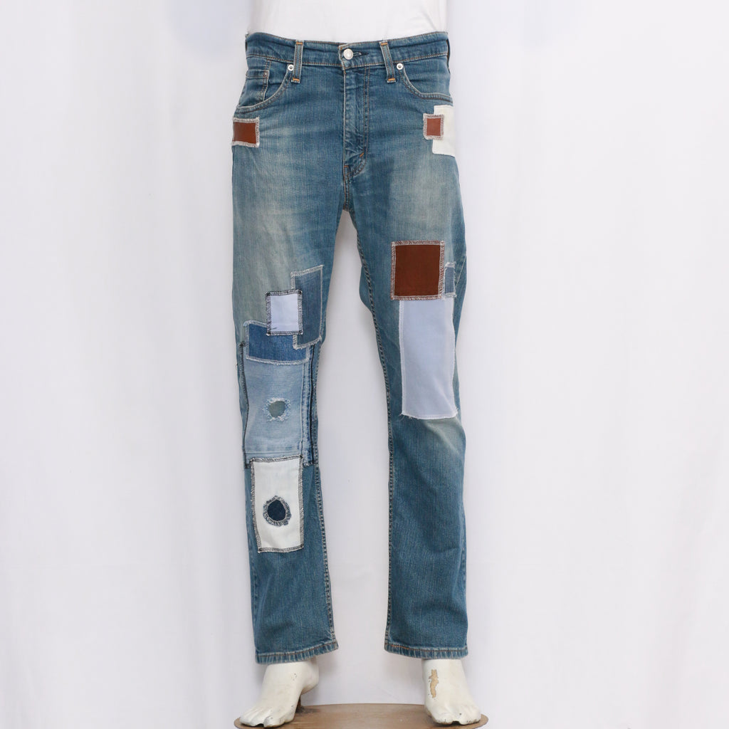 Men Reworked Denim Trouser Feature A Patchwork Design