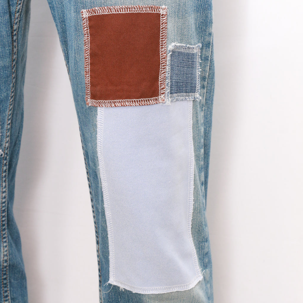 CR064 Men Reworked Denim Trouser Feature A Patchwork Design